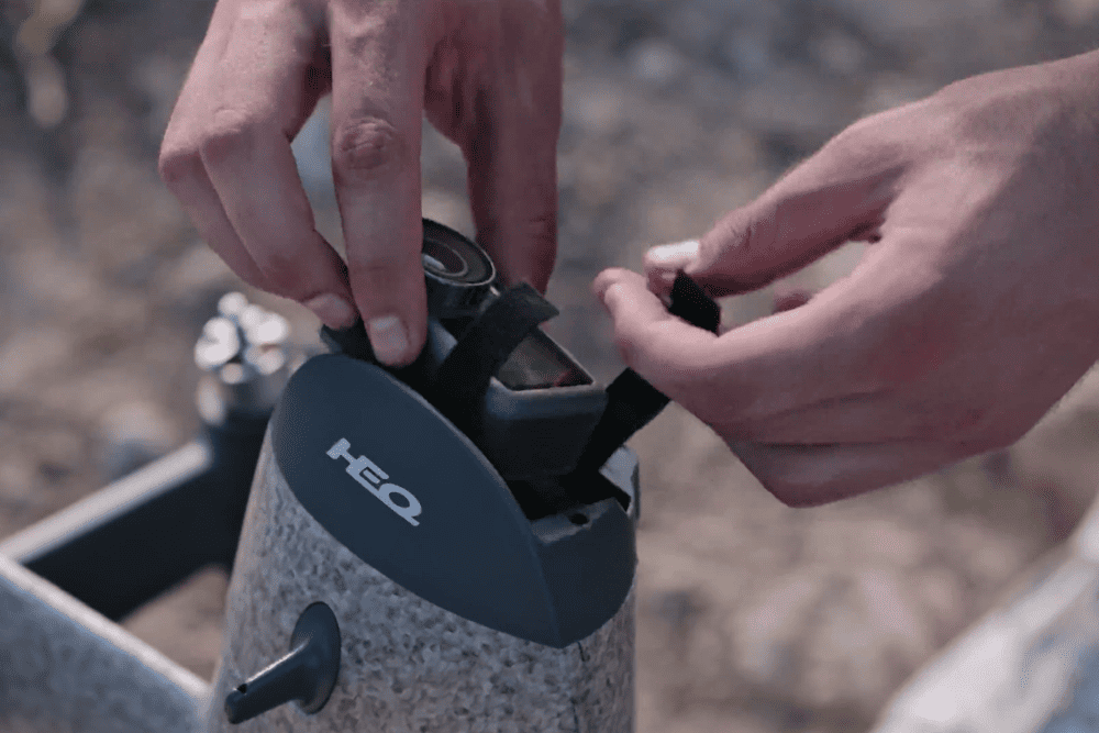 A person installing an action camera on Swan K1 Pro