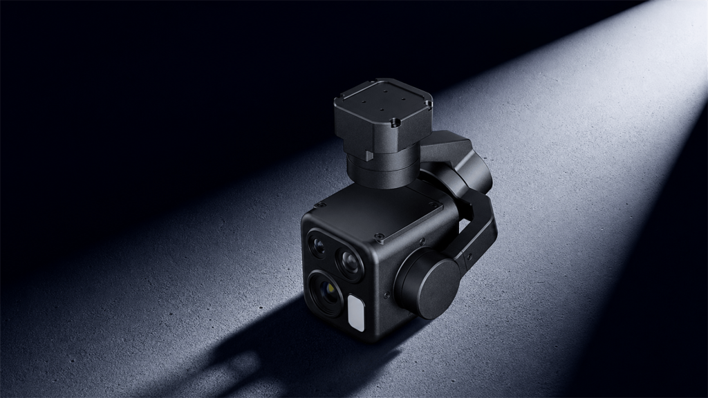 HEQ K40T-Mini quad-sensor gimbal camera for drone upper-side view, on a black textured background